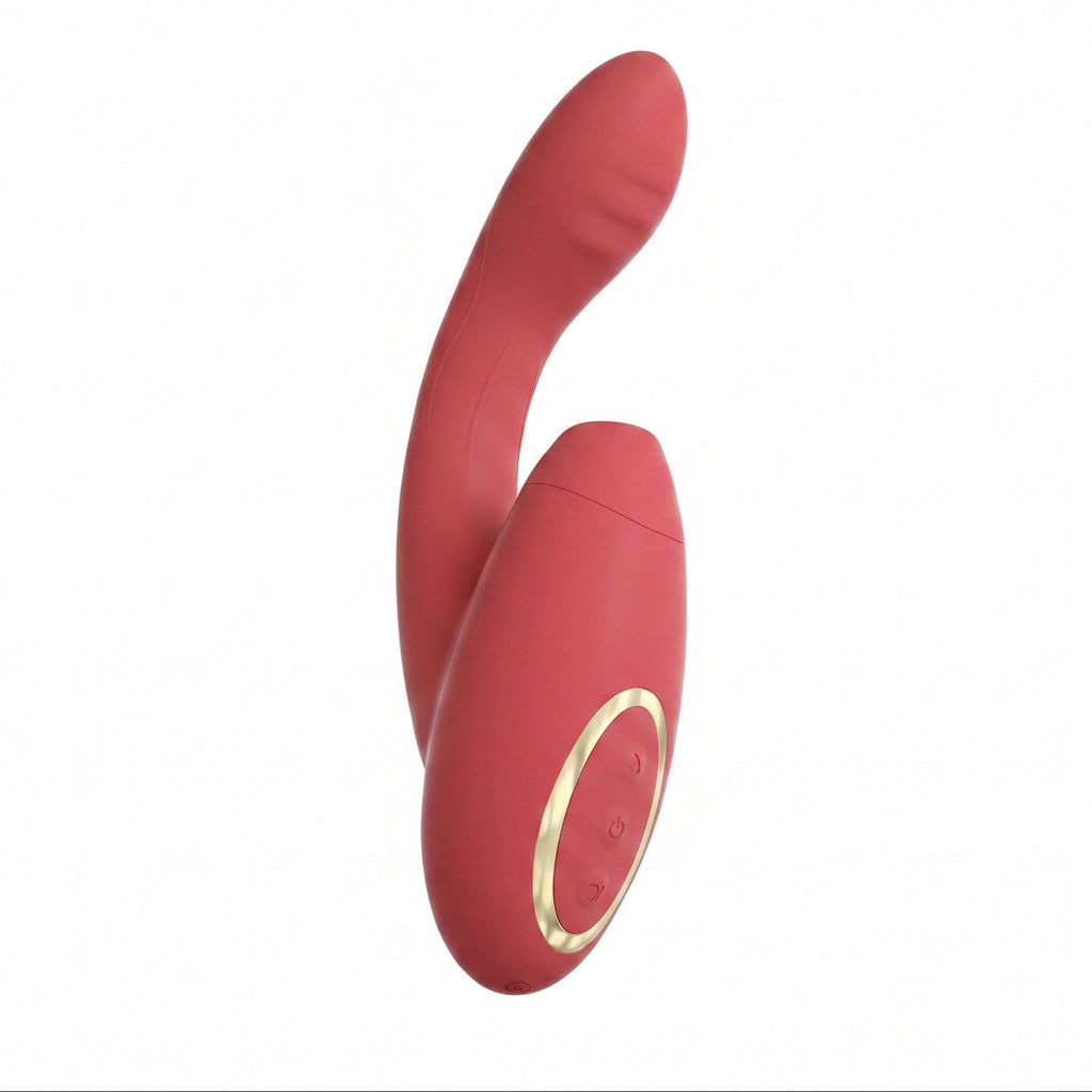 A red silicone personal massager with a curved shaft and a cylindrical base featuring a gold metallic ring accent, shown against a plain white background.
