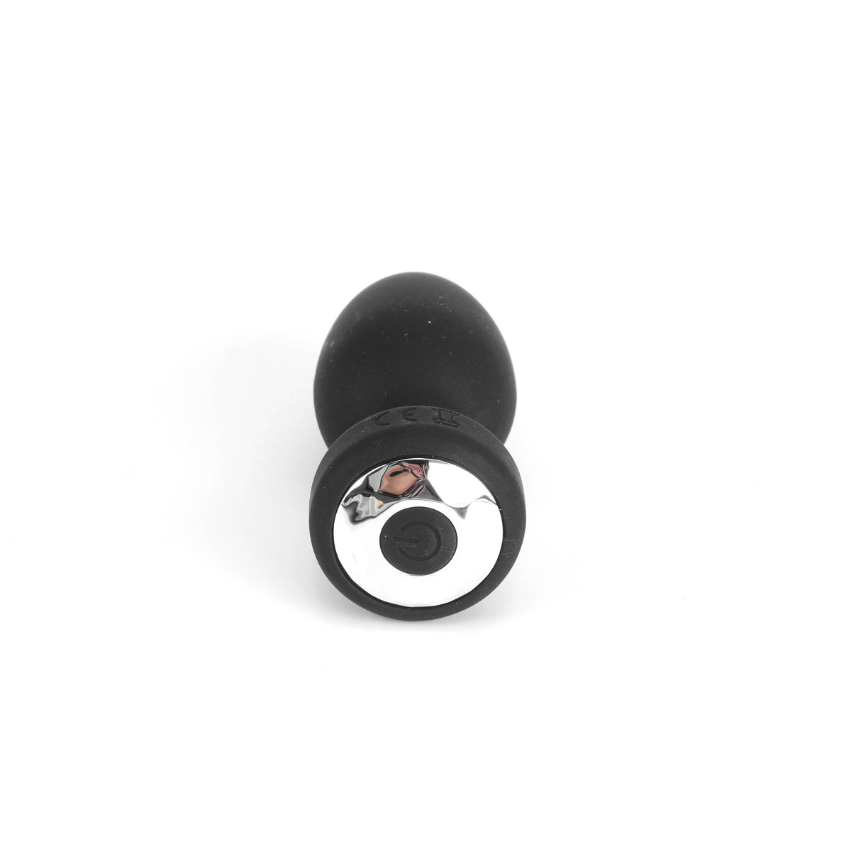 Black silicone butt plug with metallic ring on a white background
